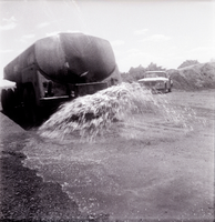 Construction vehicle spraying chipsealing of Kolob Canyon Road.