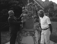 Centennial Preparation Committee members Springdale Mayor Austin Excell and Bishop Alvin Hardy pose next to 'Discovery of Zion Canyon' commemorative plaque.