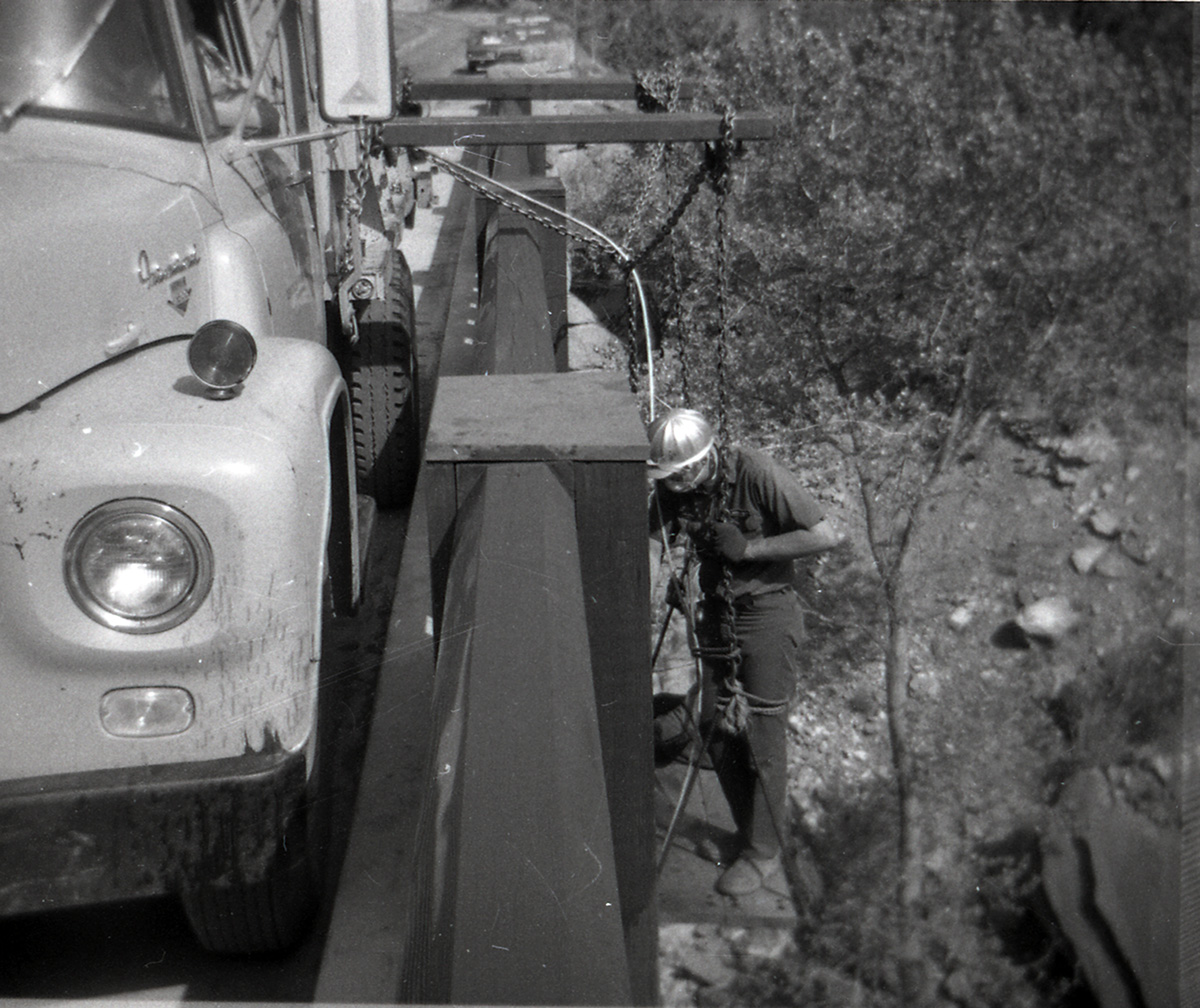 Man working on construction of Canyon Junction vehicle bridge.