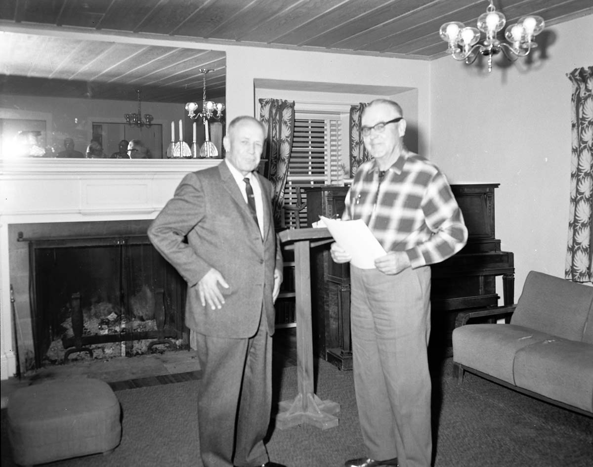 Retirement party for Arden Schieffer, Superintendent Frank R. Oberhansley presents award for meritorious service.