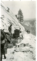 Workers cutting the stone face for the West Rim Trail construction-1924.