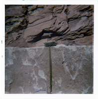 Close up of slide control wall with measuring tape.