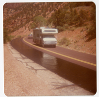 Vehicles driving in one lane while the other lane chipseal dries.