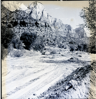 Clearing of right-of-way for new Highway 1, from South Entrance to Virgin River Bridge (Canyon Junction). The Beehives and the Streaked Wall in the distance (view north).
