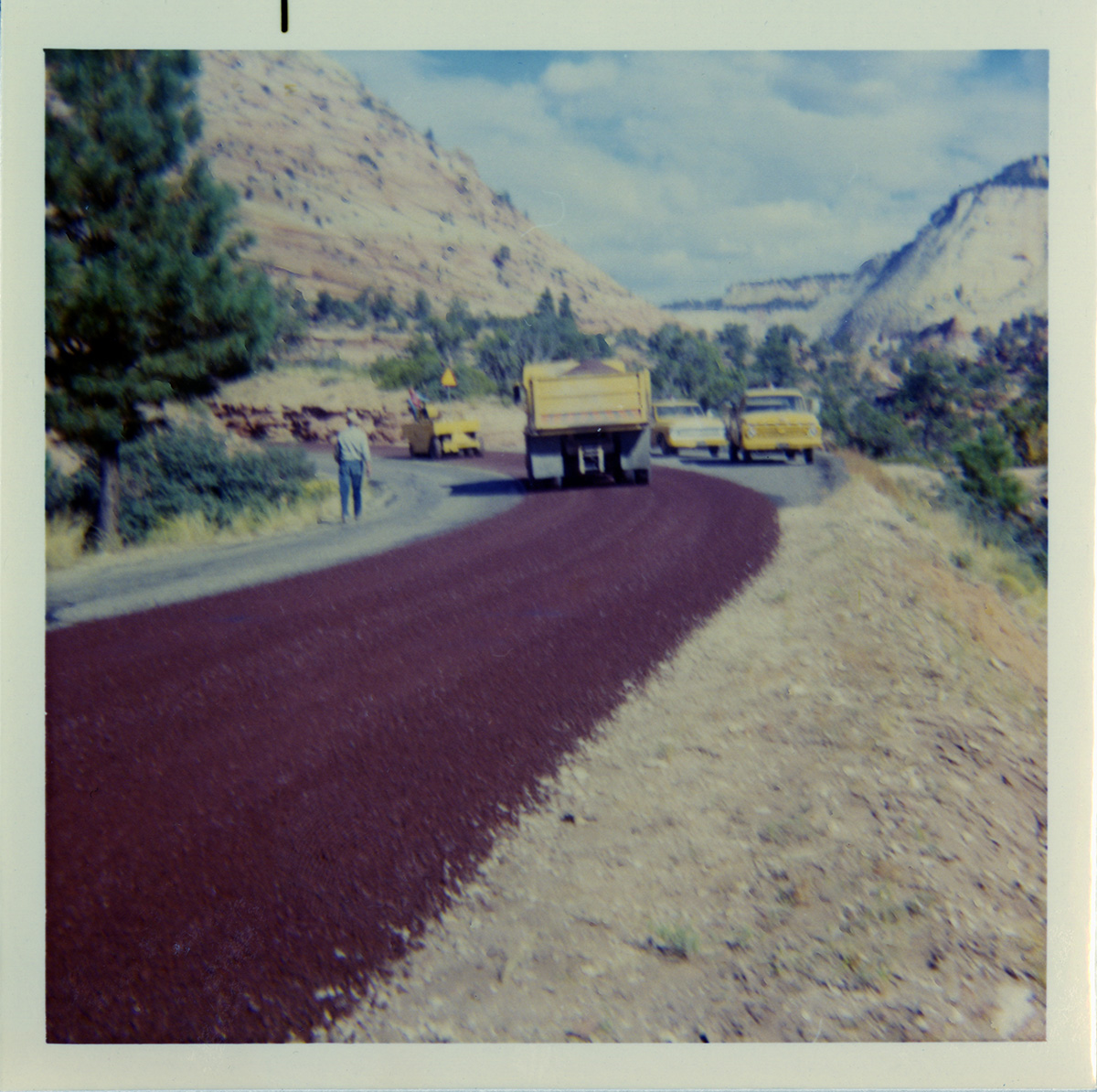 Chipsealing construction vehicles working on roads in the East side of the park.