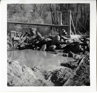 Protection/stabilization of the footings for the old Birch Creek suspension footbridge.