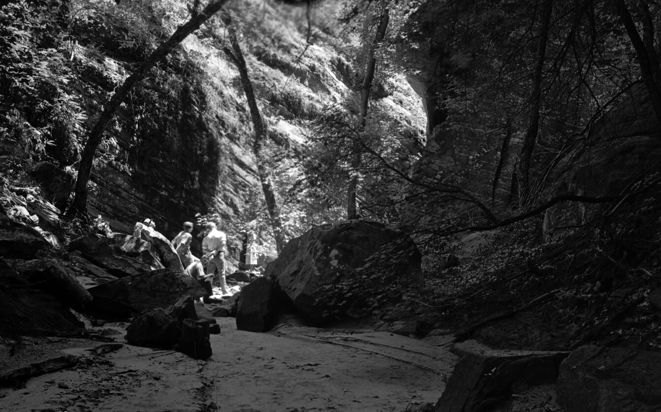 A group of visitors resting in Hidden Canyon.
