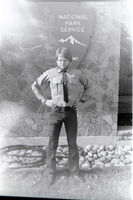 Man with beard flexing muscles.