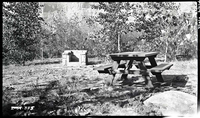 Typical campsite in South Campground with fireplace and picnic table.