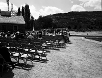 Man addressing visitors at the dedication of new Tribal and National Park Service Visitor Center and 50th anniversary at Pipe Spring National Monument.
