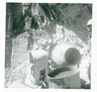 Workers operating construction equipment during the West Rim trail half tunnel maintenance/stabilization.