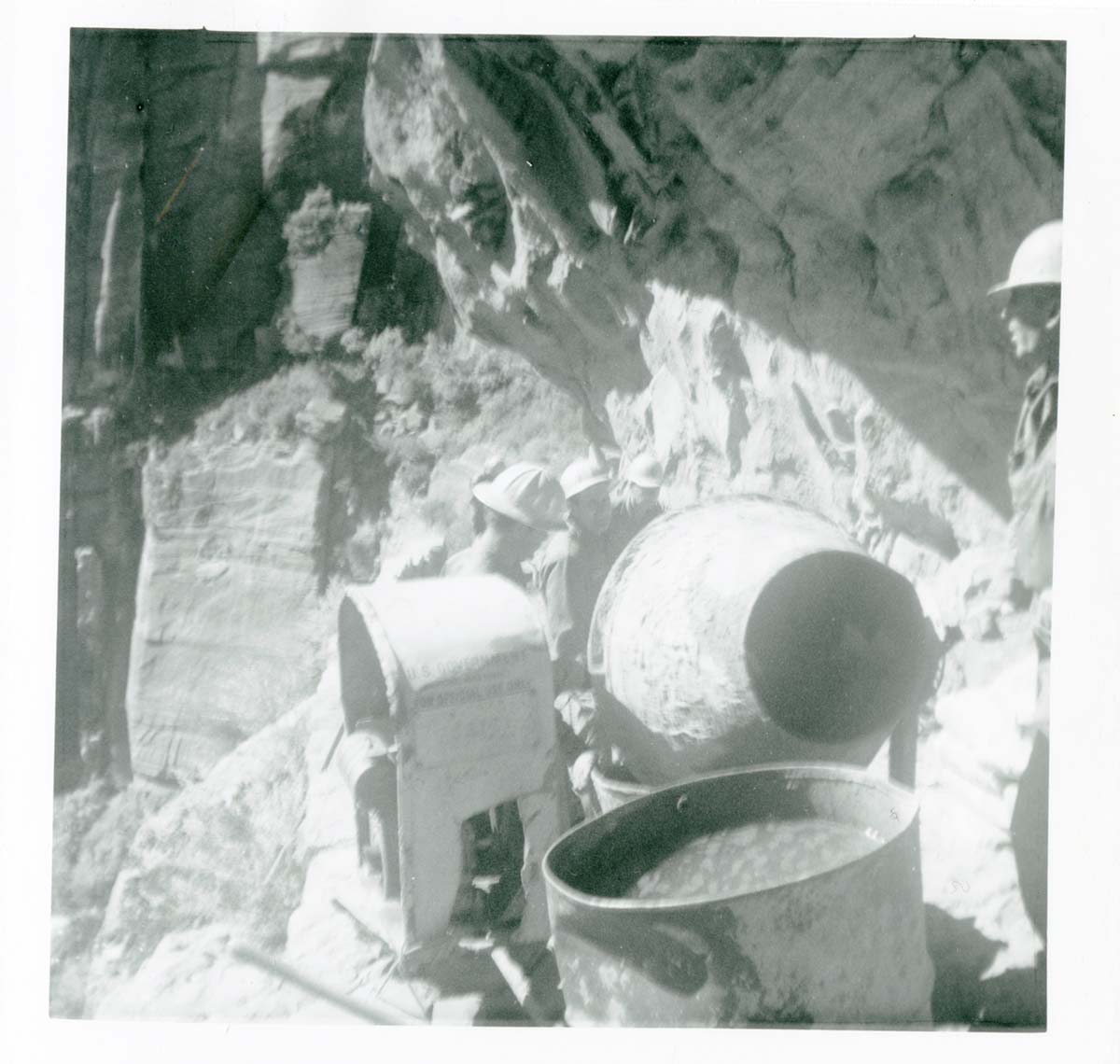 Workers operating construction equipment during the West Rim trail half tunnel maintenance/stabilization.