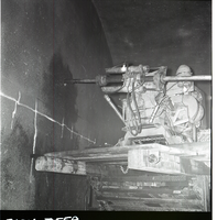 Machinery, crews drilling test cores in Zion-Mt. Carmel tunnel.