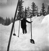 BW Photos showing rangers digging out the visitor center from snowdrift.