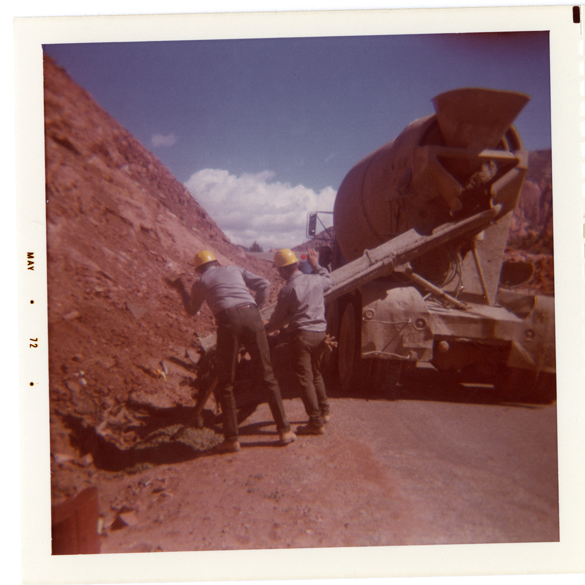 Men operating construction vehicle during road repair of Kolob Canyon Road.