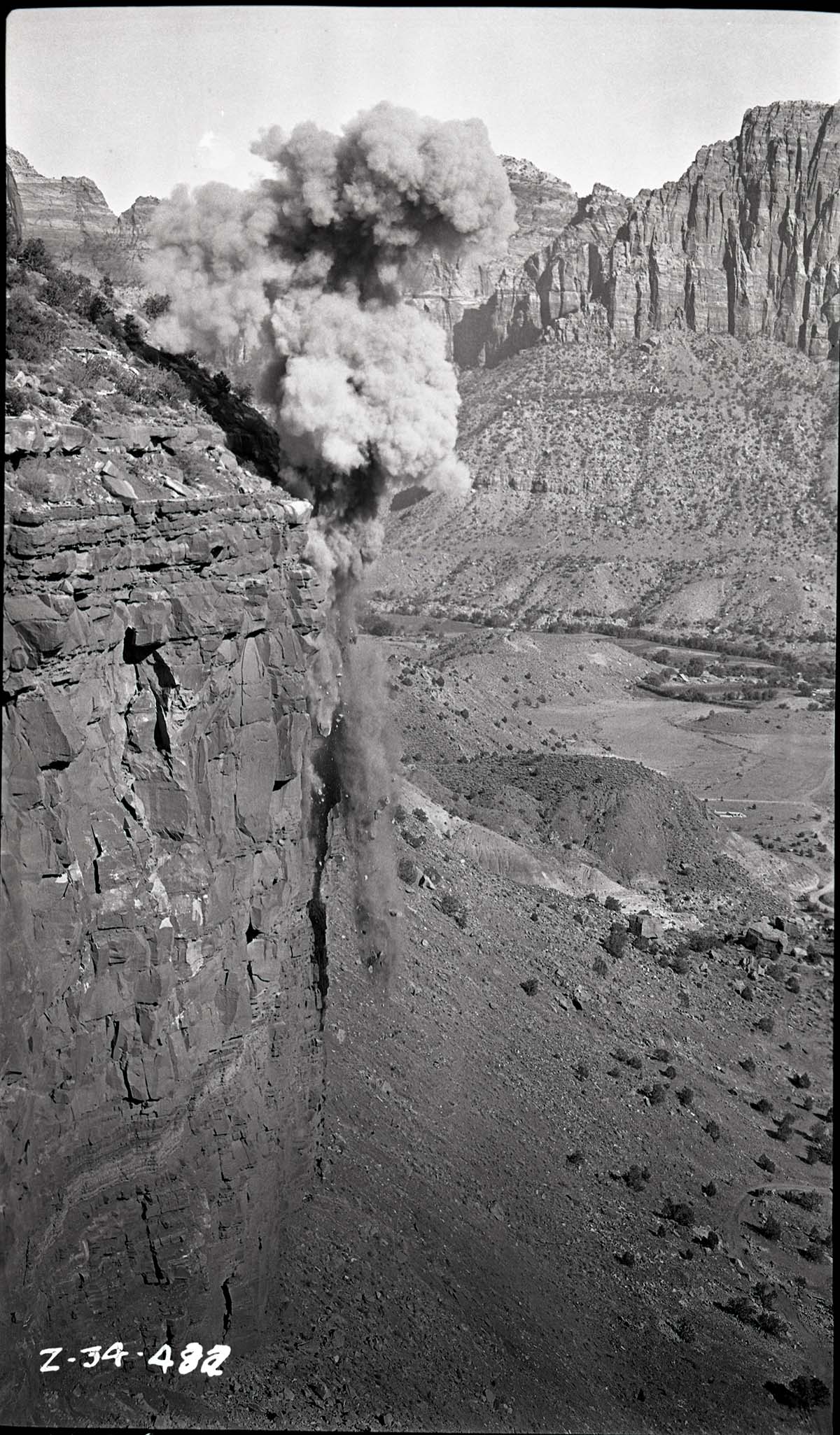 Quarrying above Springdale, clouds from blast, cliff faces.