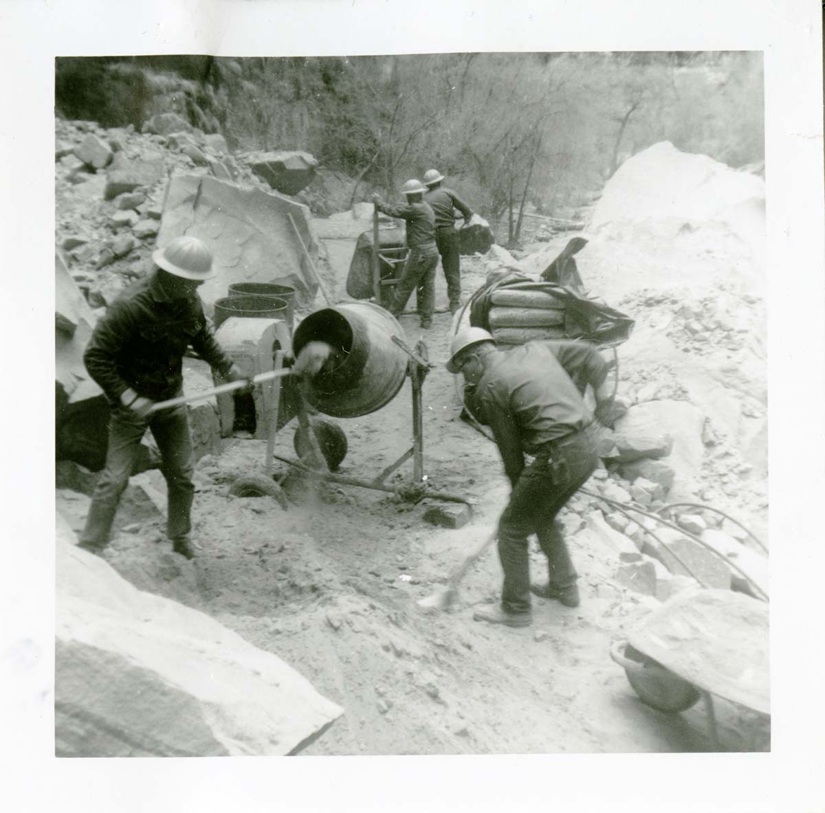 Workers operating construction machines during general trail maintenance on the Narrows.