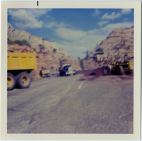 Construction vehicles performing chipsealing operations on the roads of Zion.