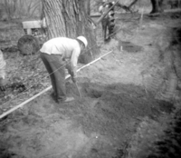 Worker digging during the clearing/cleaning and setting up of the lodge spray field.
