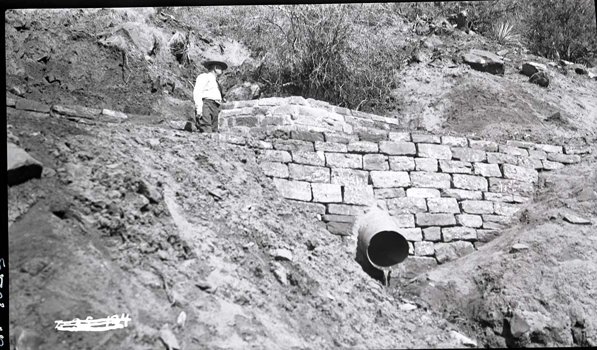 Parunuweap Trail construction with stone retaining wall and culvert.