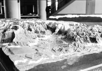 Zion National Park relief map exhibit, with a close-up view of the retouch work completed by Zion park ranger Clifford C. Presnall. Photographed by Civilian Conservation Corps (CCC) worker Putnam in a workshop at the Western Museum Laboratory (WML) in Berkeley, California in 1935.