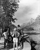 Victor L. Jackson, Chief Park Naturalist and 1982 Freeman Tilden Award winner for outstanding interpreter of the year. Victor speaking with visitors at the Mission 66 Visitor Center and Museum.