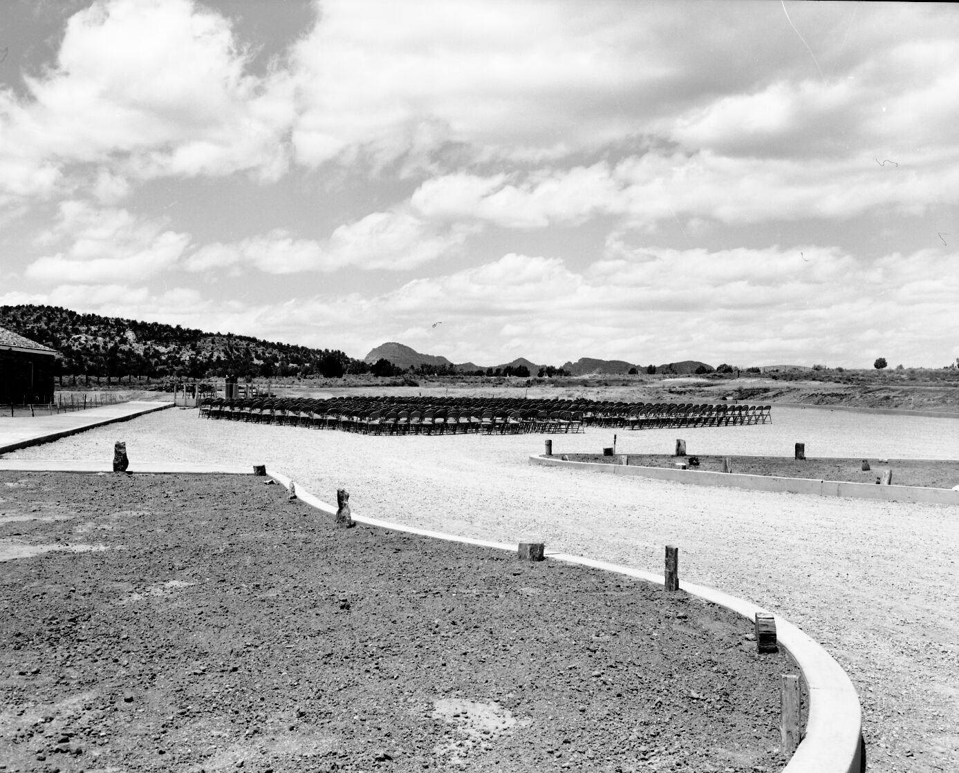 Chairs and grandstand in the parking area set up prior to dedication of new Tribal and National Park Service Visitor Center and 50th anniversary celebration at Pipe Spring National Monument.