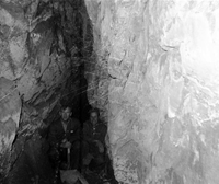Two men with shovels in cave. The cave of Cave Valley.