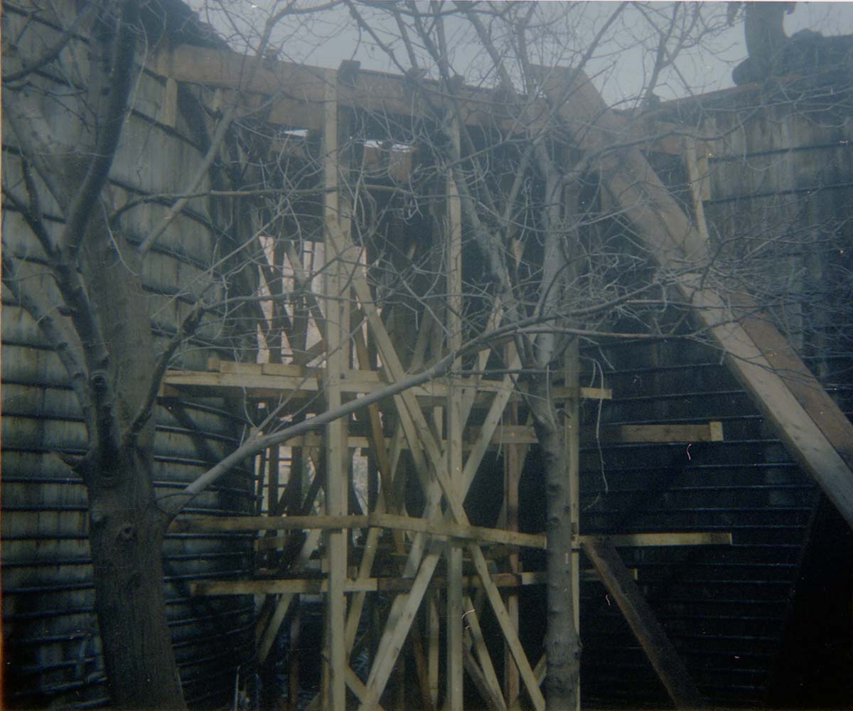 Scaffolding built between water tanks during reroofing project.