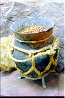 Color photos of prehistoric jar (North Creek Gray) display.