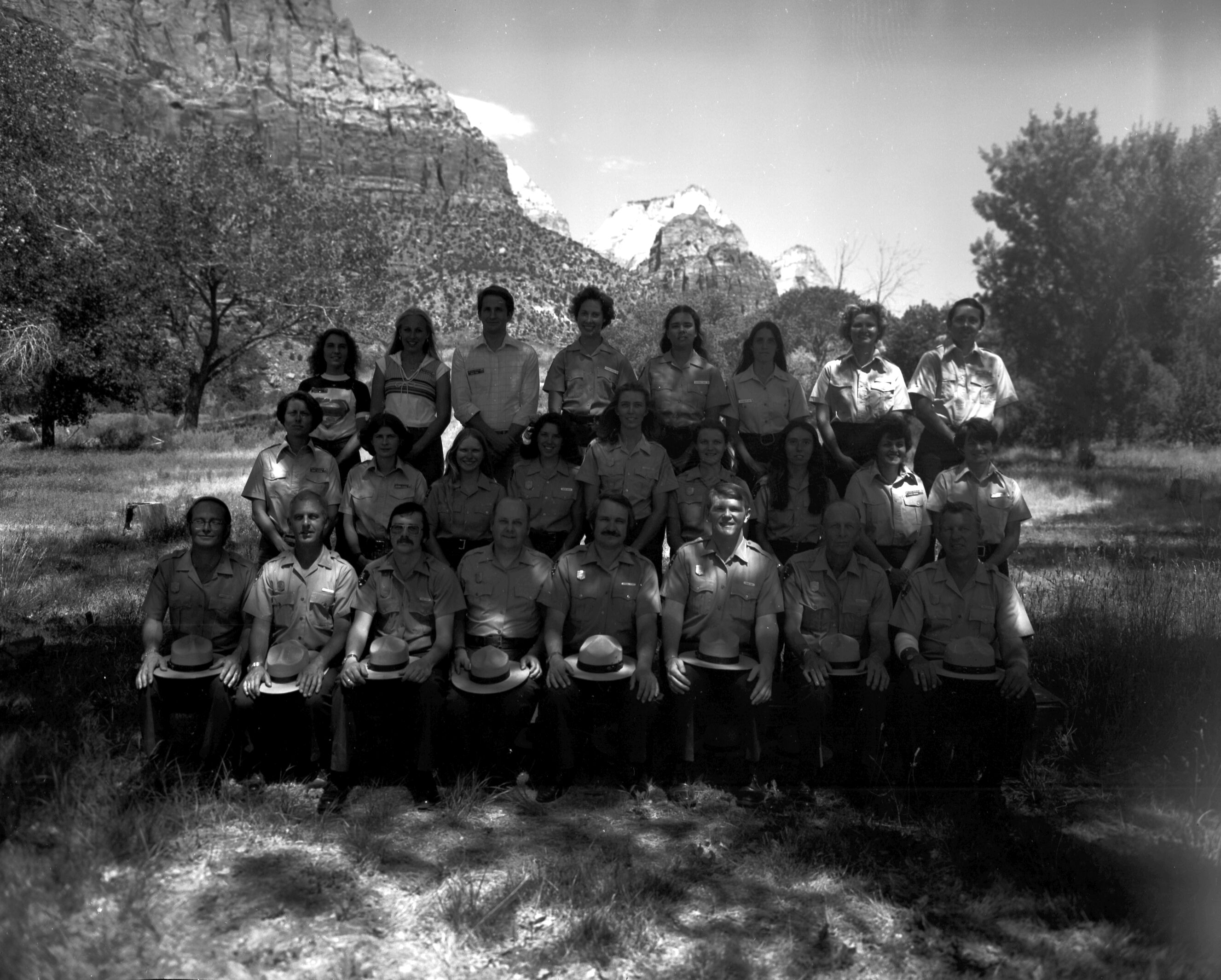 Personnel 1980: naturalist division, Student Conservation Association (SCA), Zion Natural History Association (ZNHA), Zion Nature School (ZNS). Front row (left to right): (two unidentified people), Bob Wood, Victor Jackson, John Lancaster, Roy Given, (two unidentified people). Center row (left to right): Caroline Nicholson, Marion Hilkey, (seven unidentified people). Top row (left to right): Joel Fishbien, Chris Dick, (five unidentified people), Kathy Picarelli.