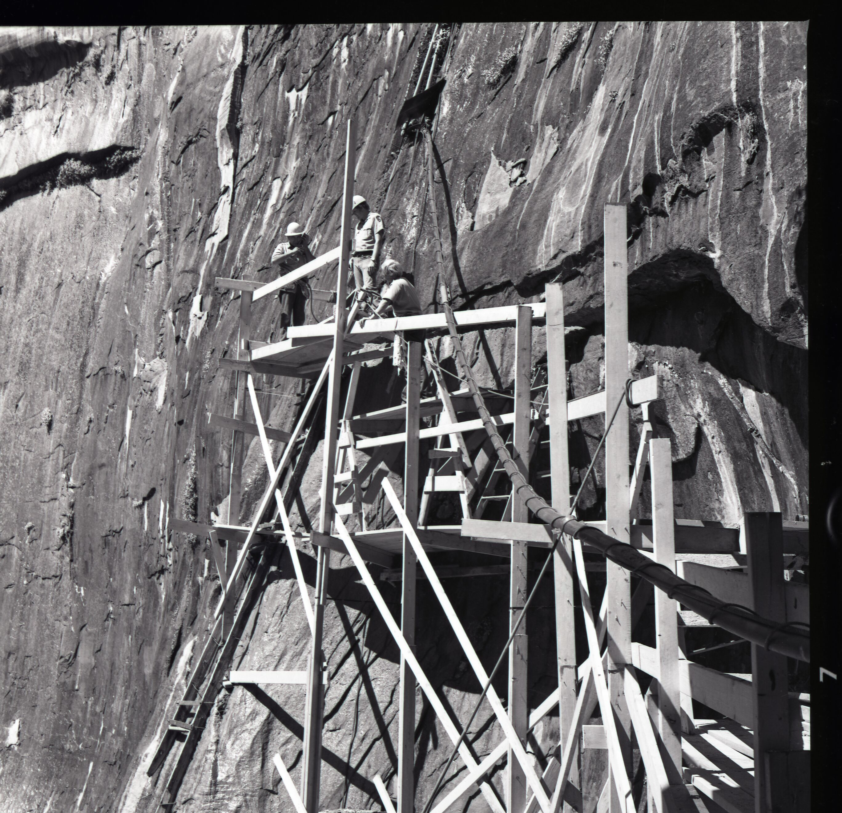 Wooden scaffolding and workers used for upgrade of water system at Temple of Sinawava.
