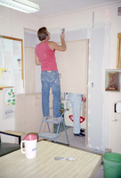 Man working on the construction of headquarters addition.