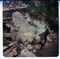 Stone and cement abutment in progress along Virgin River, built for new Grotto footbridge.
