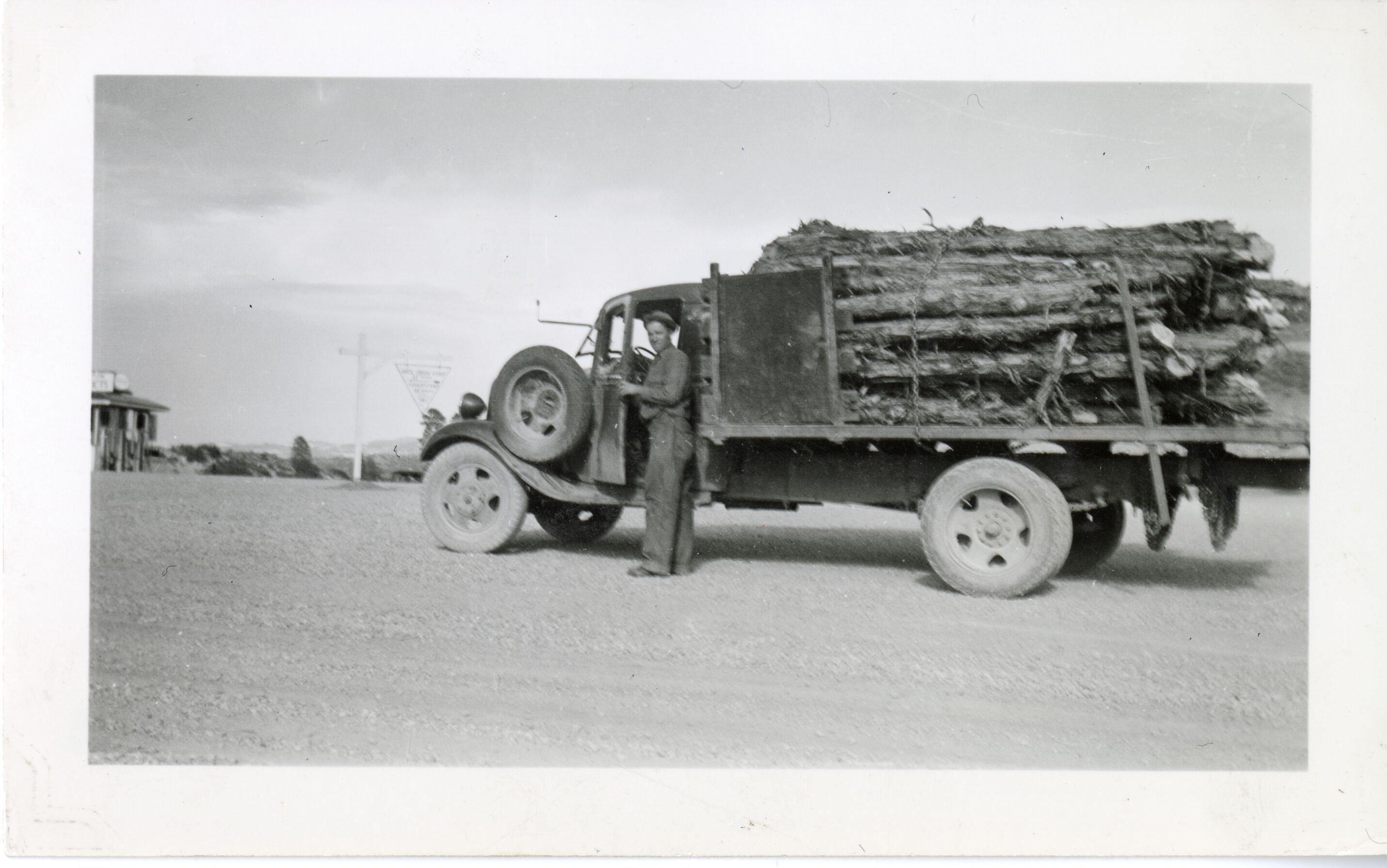 CCC WORKER, TRUCK AND FENCE POSTS