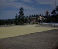 Man spraying foam sealant during reroofing project. Bryce Canyon National Park.