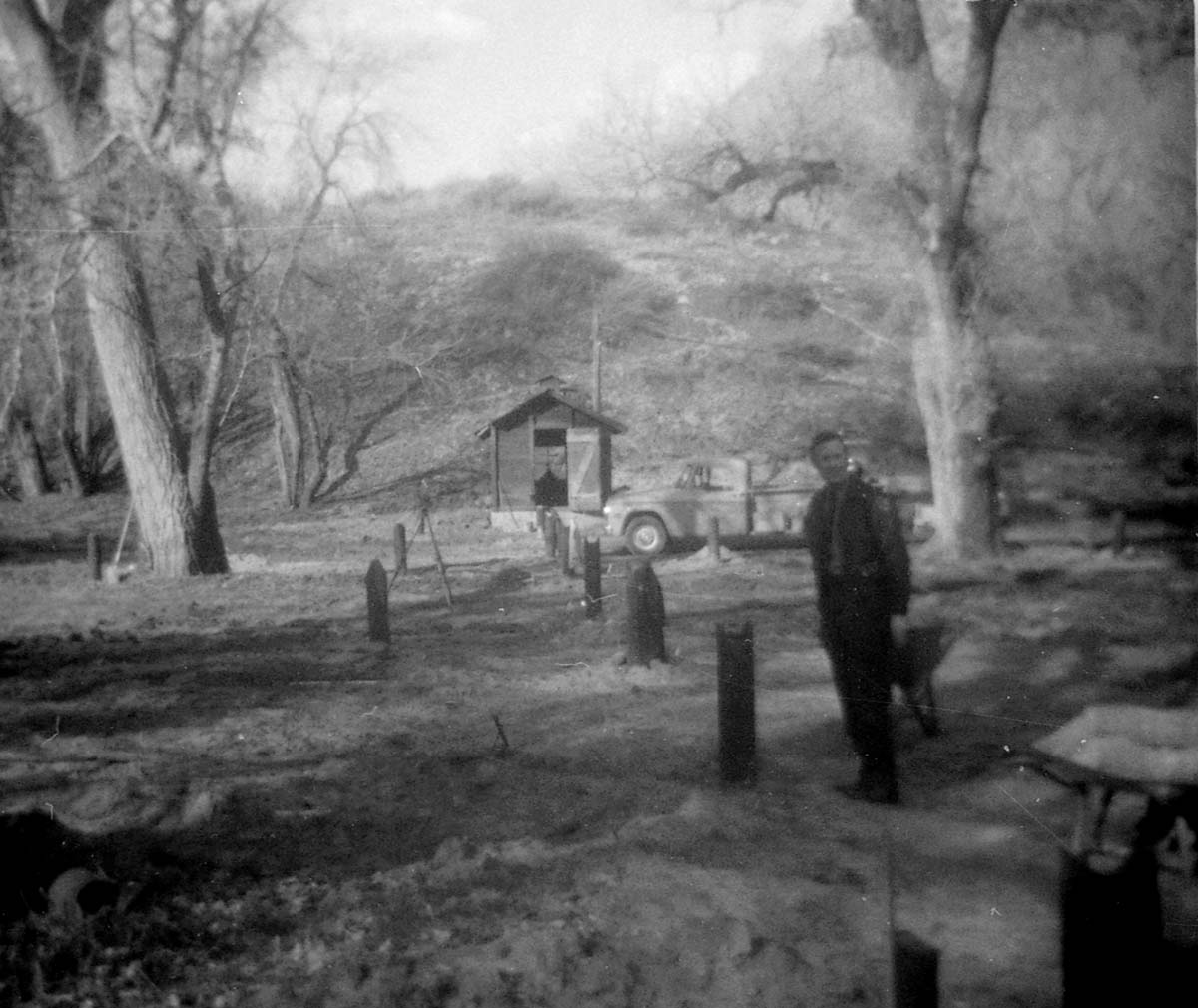 Workers clearing/cleaning and setting up the lodge spray field.