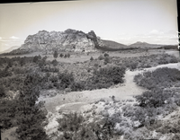 Improper land use- dirt tank for catching flood water.