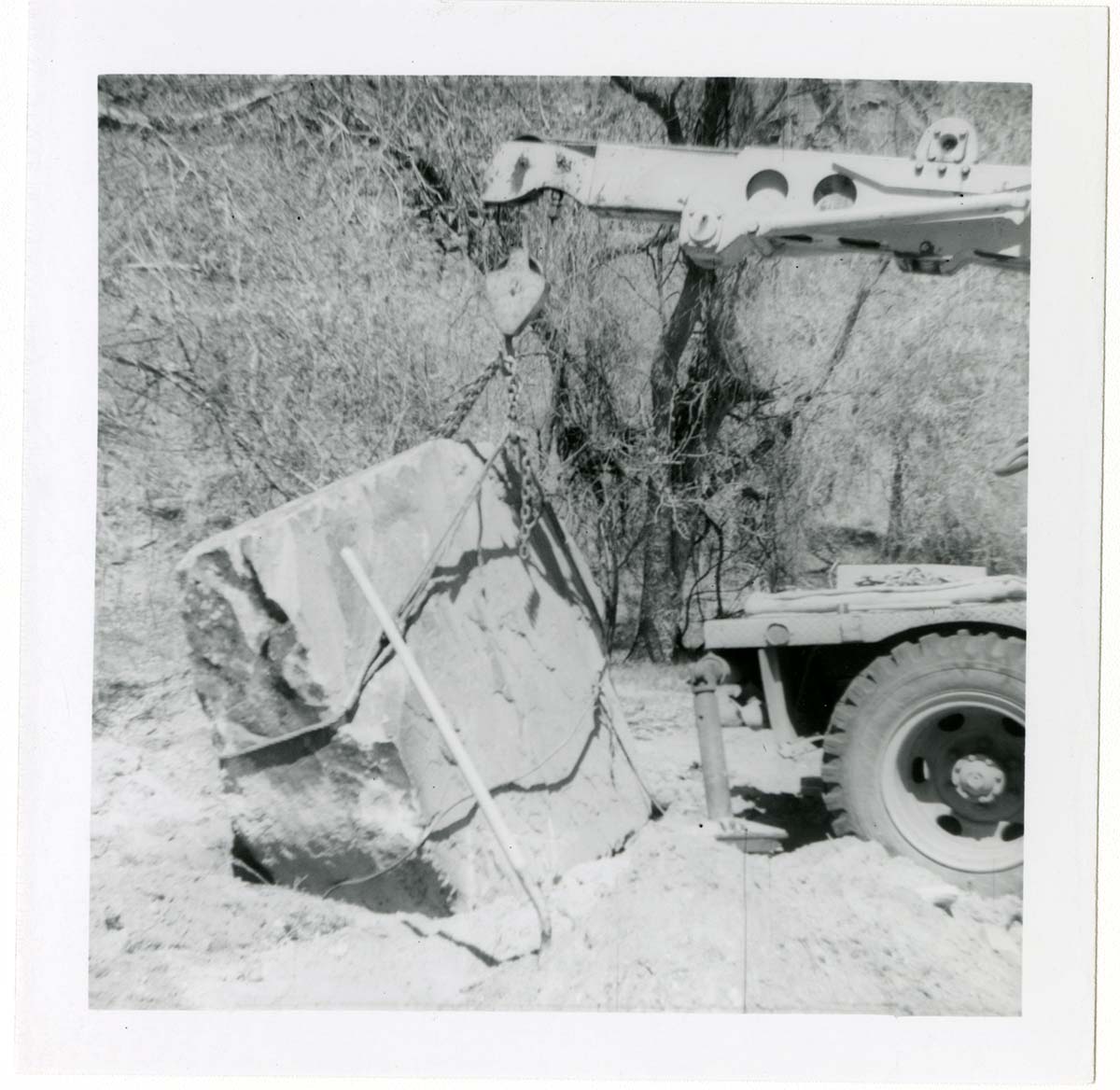 Construction vehicle placing rock during the Lady Mountain sign emplacement.