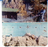 The destruction of the lodge pool and bathhouse.