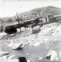 Construction vehicle in rocky area during chipsealing of Kolob Canyon Road.