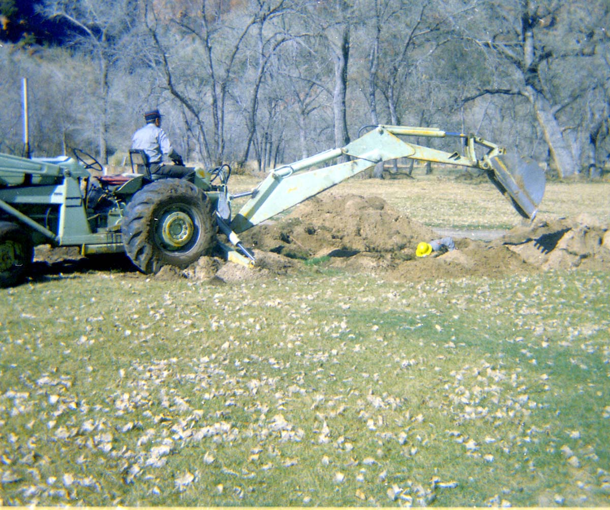 Man operating excavator during the Zion Lodge utilities project.