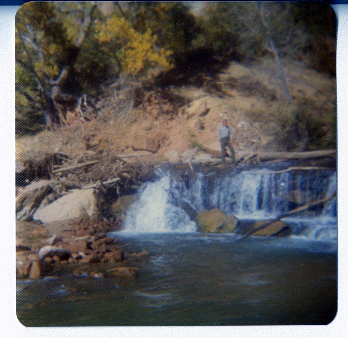 Man standing by the Birch Creek Dam.
