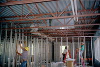 Men working during the construction of headquarters addition.