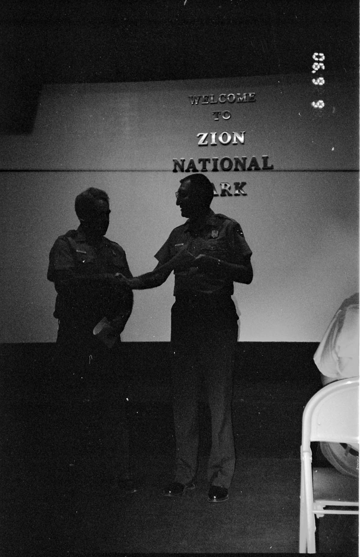 BW Photos of Superintendent Harold Grafe giving out awards to park personnel.