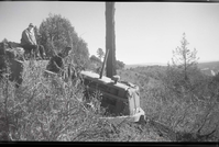 Two crewmen and maintenance equipment used on West Rim Trail near ranger cabin and White Ledges.