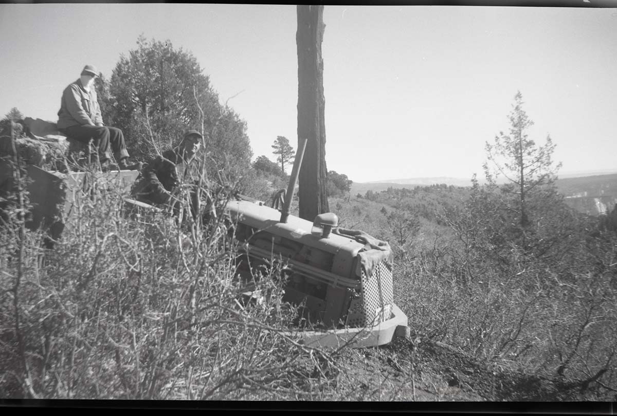 Two crewmen and maintenance equipment used on West Rim Trail near ranger cabin and White Ledges.