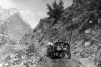 Louis Crawford family and relatives on outing in Zion Canyon, riding in horse-drawn cart on dirt road in Zion Canyon.