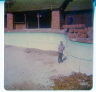 Workers preparing for the destruction of the lodge pool and bathhouse.