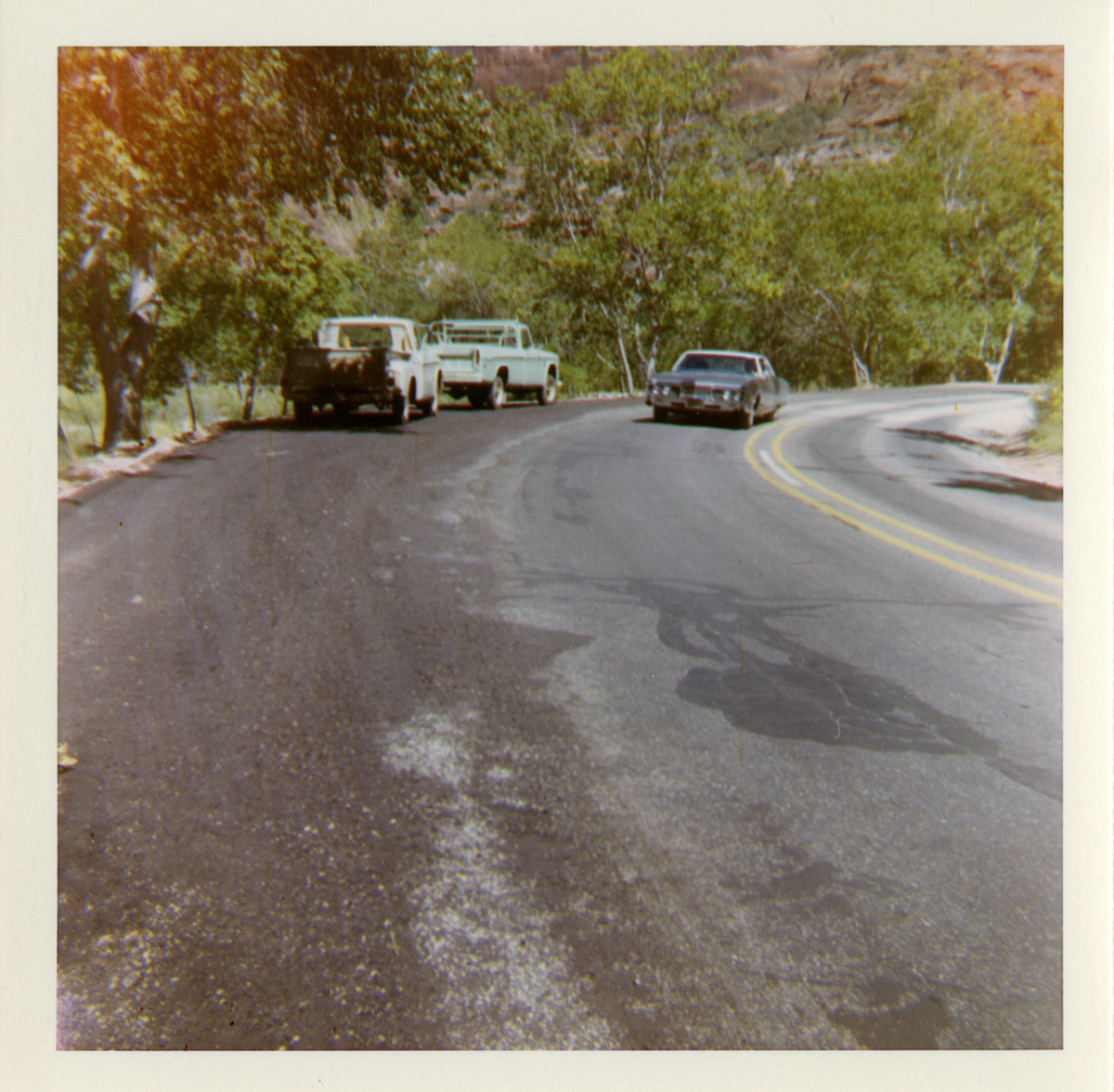 Vehicles using shoulder along route 2 parking areas.